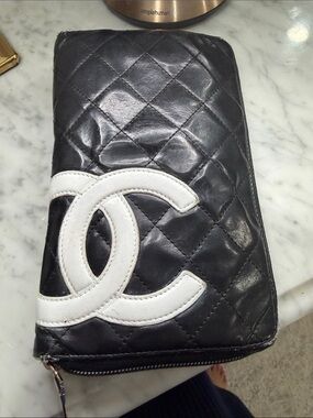CHANEL Black Quilted Leather Zip Wallet with White CC Patch